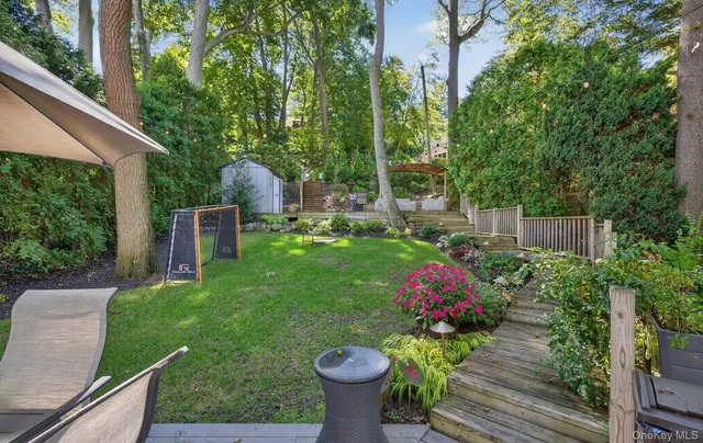 a view of balcony with wooden floor and outdoor seating