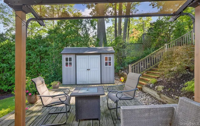 a view of a chairs in a backyard