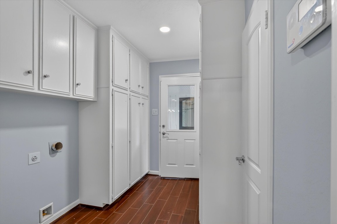 5923 Rutherglenn Drive Houston, TX 77096 - Photo 39 of 46 Oversized Laundry Room w/Built in Cabinets with extra storage!