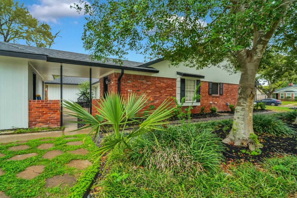 5923 Rutherglenn Drive Houston, TX 77096 - Photo 43 of 46 Lush Landscape in Backyard