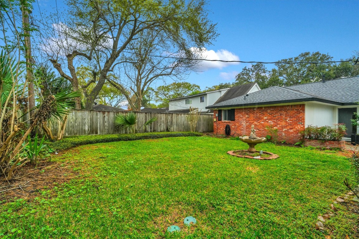5923 Rutherglenn Drive Houston, TX 77096 - Photo 46 of 46 Lush Landscape in Backyard