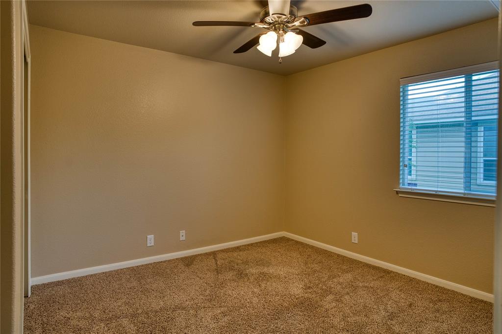 821 Gabriel Mills Drive Round Rock, TX 78664 - Photo 11 of 15 an empty room with a window and a fan