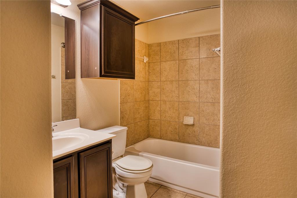 821 Gabriel Mills Drive Round Rock, TX 78664 - Photo 12 of 15 a bathroom with a sink and a mirror