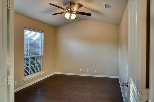 a view of an empty room with a window