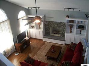 141 Surfside Road Mooresville, NC 28117 - Photo 4 of 16 a living room with furniture and a fireplace