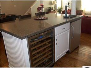 141 Surfside Road Mooresville, NC 28117 - Photo 8 of 16 a kitchen with a sink and cabinets