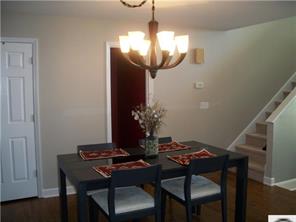 141 Surfside Road Mooresville, NC 28117 - Photo 9 of 16 a view of a dining room with furniture and wooden floor