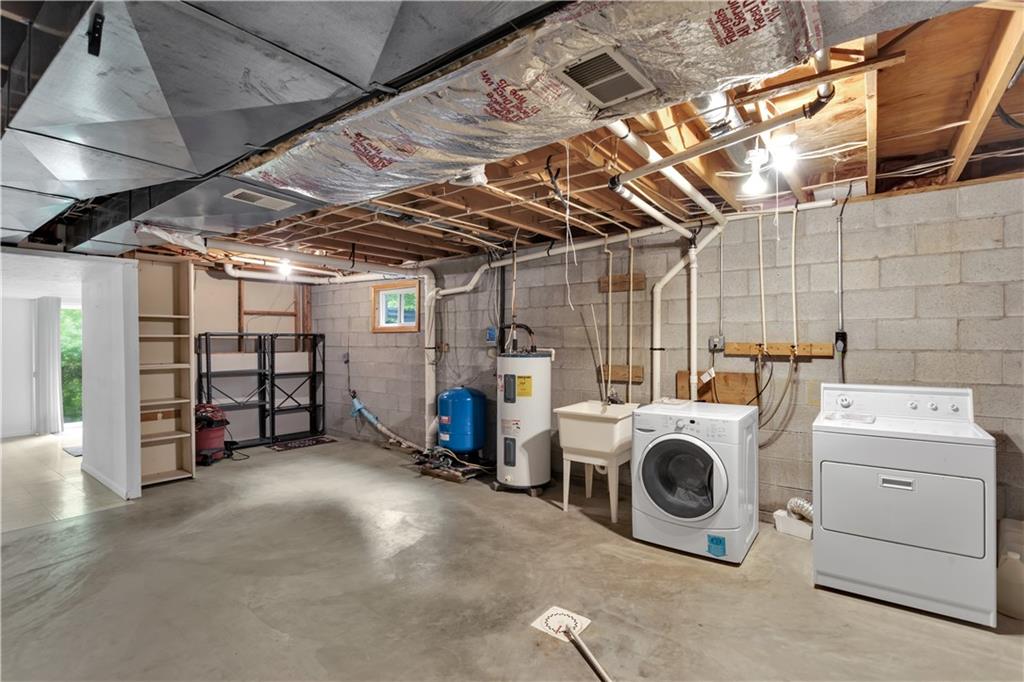 1860 Washington Road Apollo, PA 15613 - Photo 32 of 41 Laundry Area with Washer, Dryer, Utility Sink and Shelves Included.