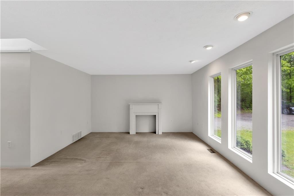 1860 Washington Road Apollo, PA 15613 - Photo 6 of 41 19x14 - Highlighted by a Decorative Fireplace Mantle and Floor to Ceiling Windows