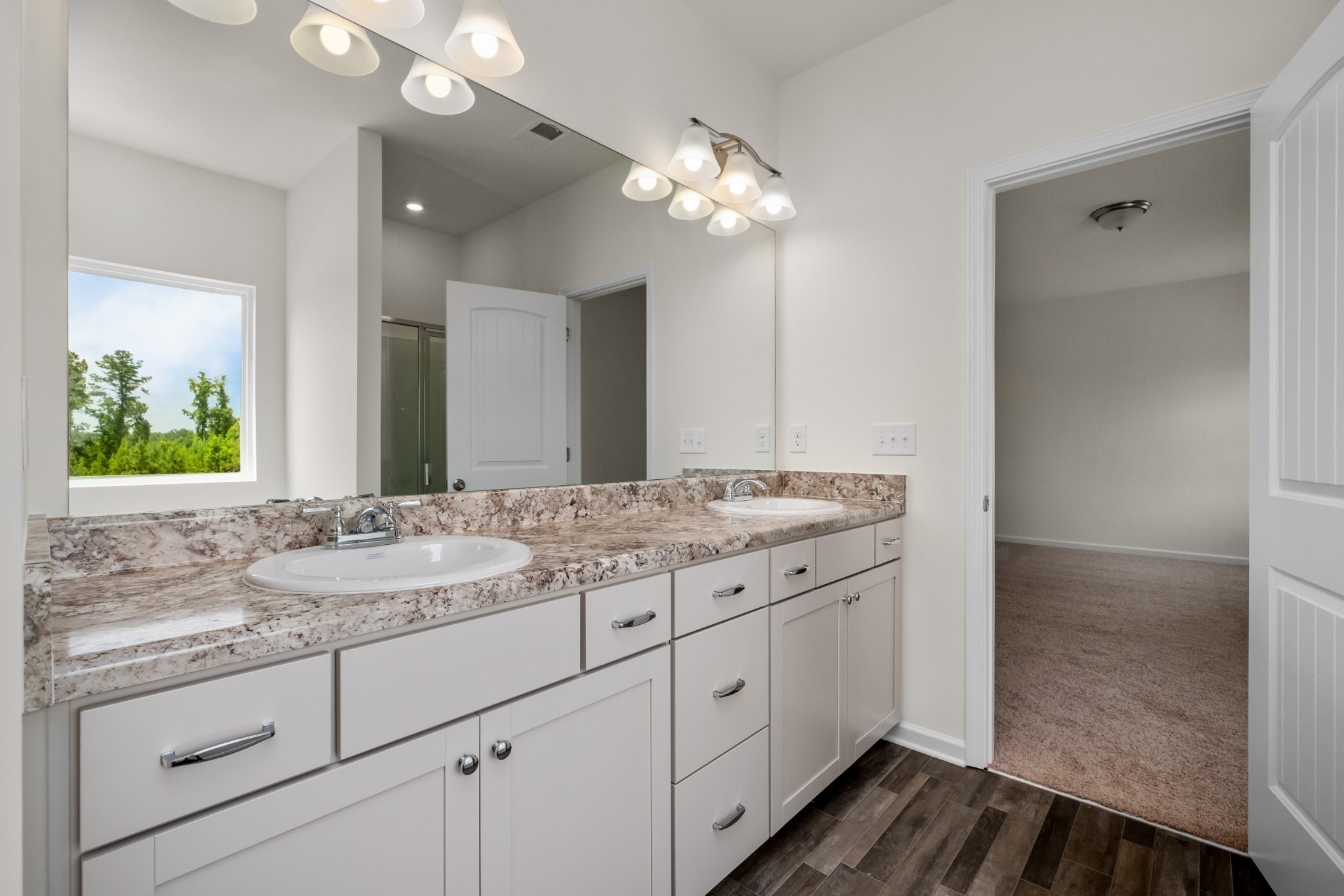 348 Winston Way Gallatin, TN 37066 - Photo 21 of 26 a bathroom with a granite countertop double vanity sink and mirror