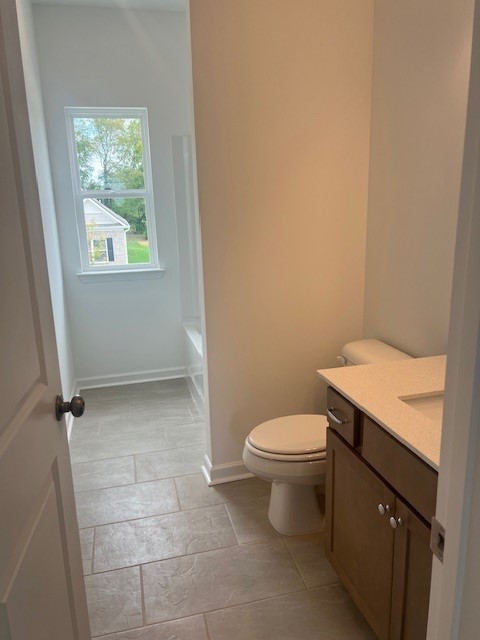 348 Winston Way Gallatin, TN 37066 - Photo 23 of 26 a bathroom with a granite countertop toilet and a sink