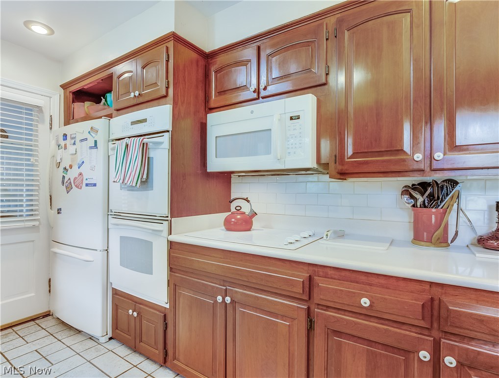 1072 Brandon Road Cleveland, OH 44112 - Photo 6 of 24 16 x 9 foot Kitchen features Beautiful Hardwood Cabinets and Corian Countertops.
