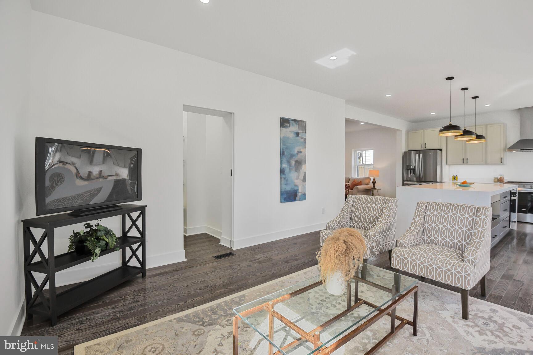1612 Noyes Drive Silver Spring, MD 20910 - Photo 12 of 37 a living room with furniture and a flat screen tv