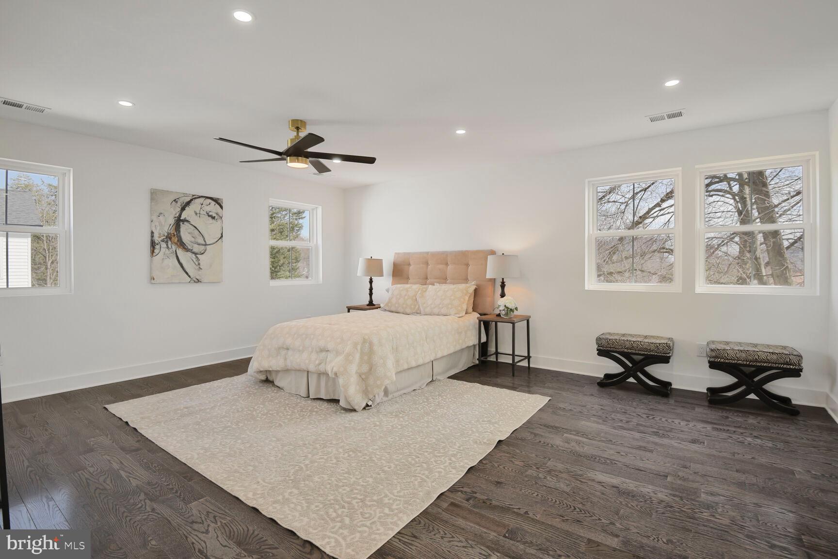 1612 Noyes Drive Silver Spring, MD 20910 - Photo 14 of 37 a spacious bedroom with a bed and wooden floor