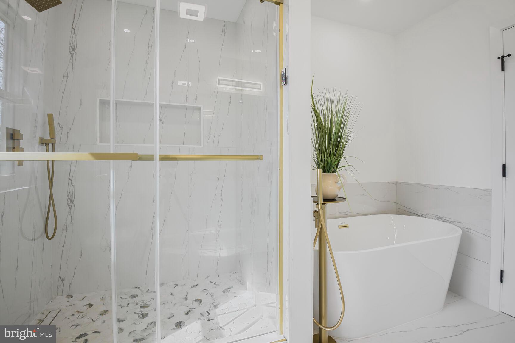 1612 Noyes Drive Silver Spring, MD 20910 - Photo 16 of 37 a bathroom with a bathtub and shower