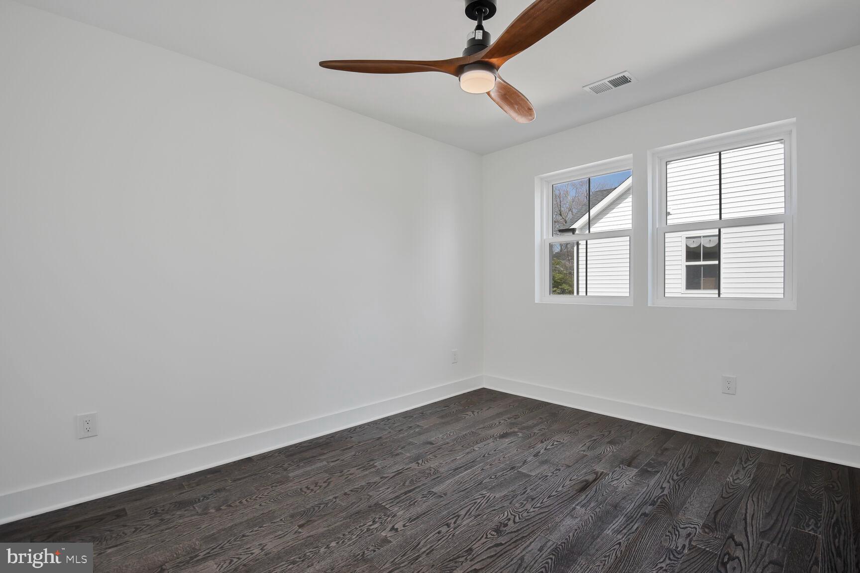 1612 Noyes Drive Silver Spring, MD 20910 - Photo 21 of 37 wooden floor in an empty room with a window