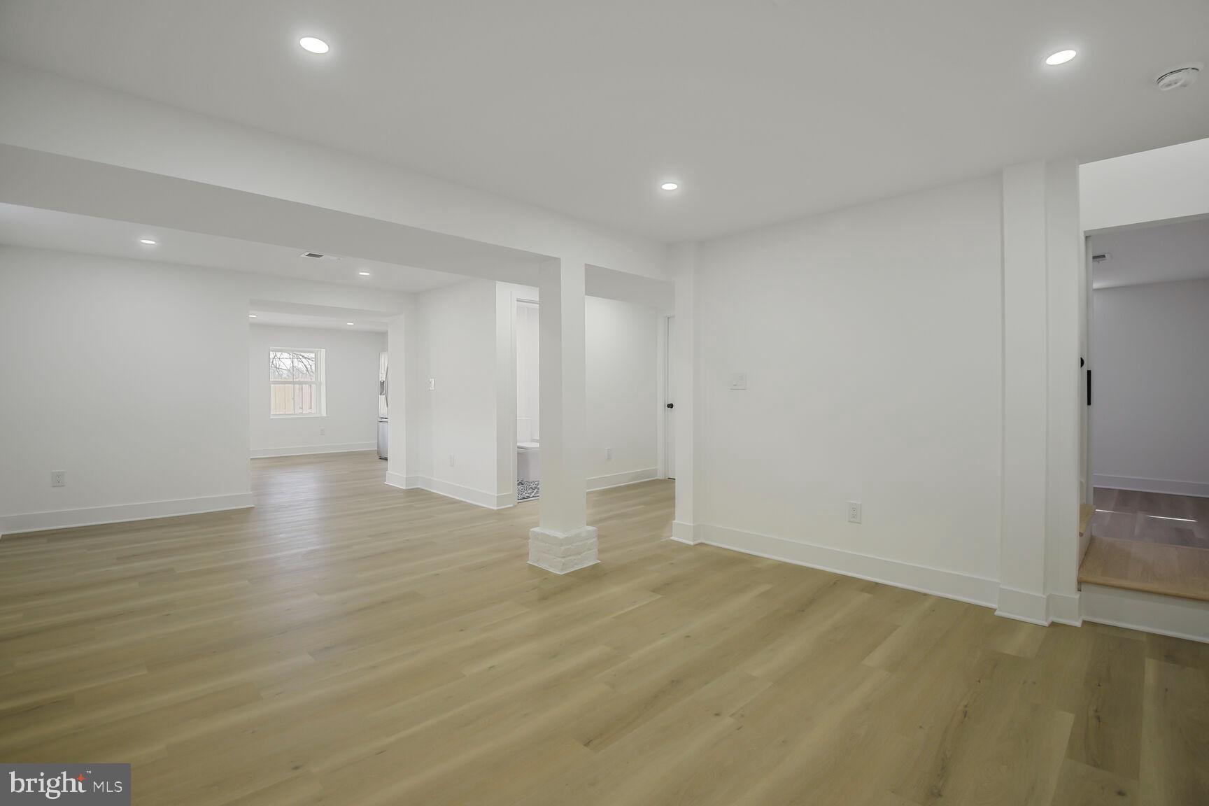 1612 Noyes Drive Silver Spring, MD 20910 - Photo 23 of 37 a view of empty room with wooden floor and window