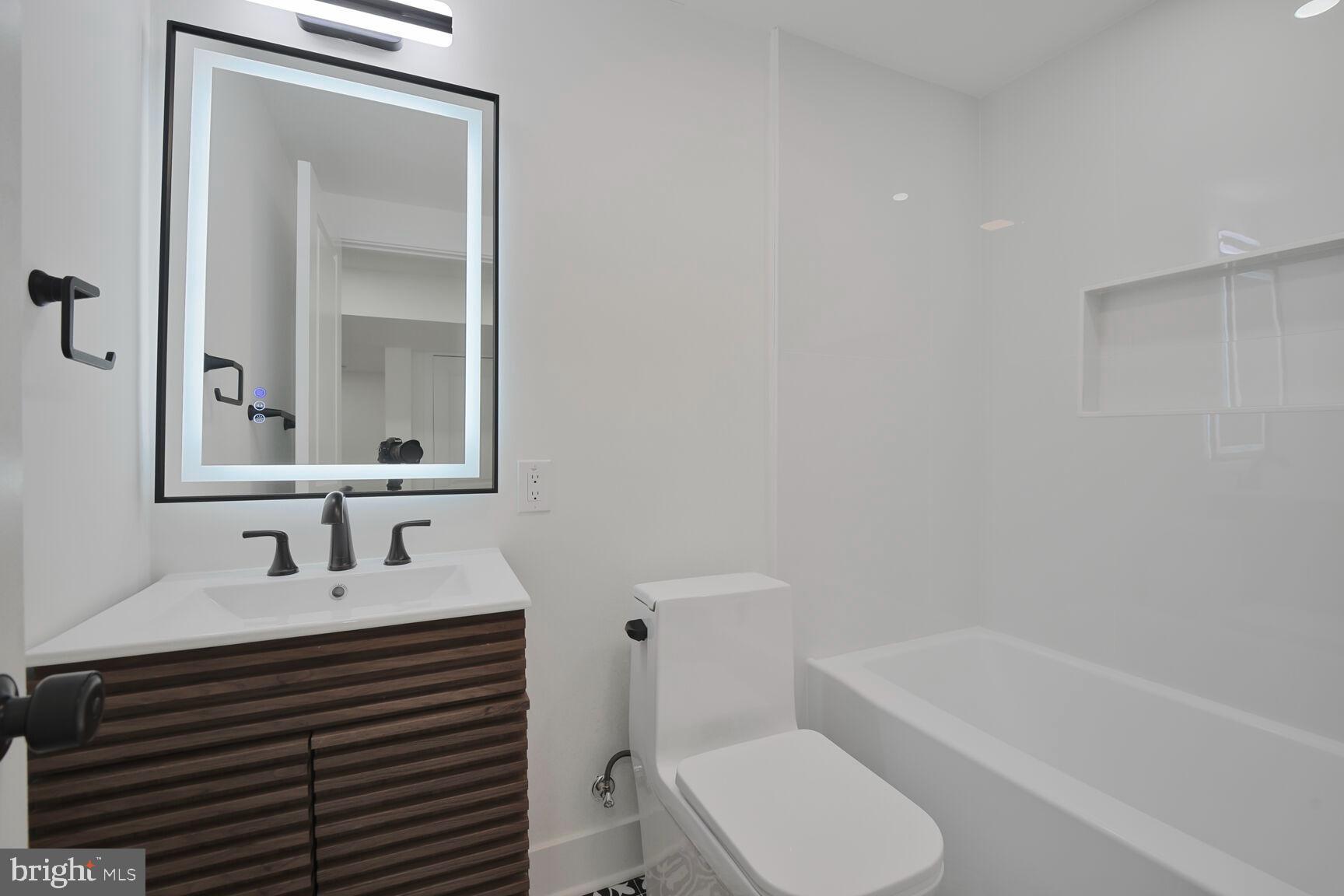 1612 Noyes Drive Silver Spring, MD 20910 - Photo 27 of 37 a bathroom with a sink toilet and shower