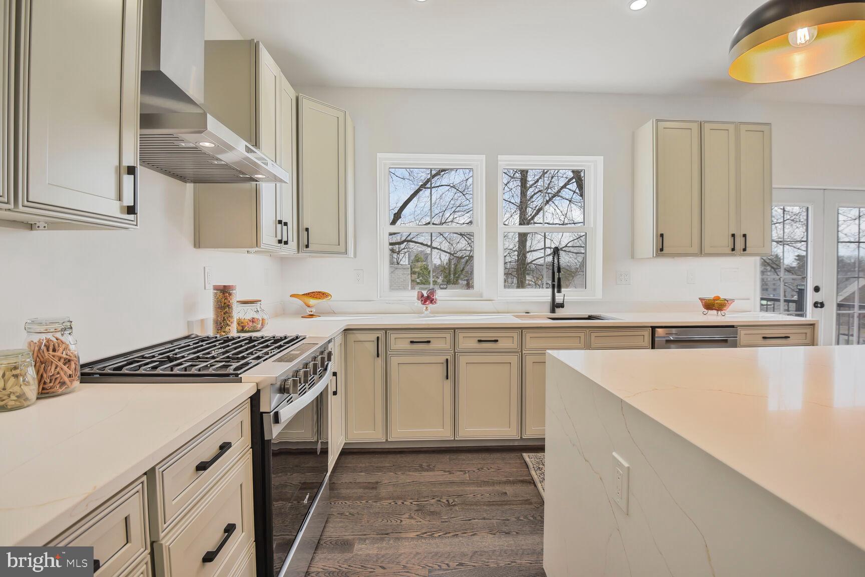 1612 Noyes Drive Silver Spring, MD 20910 - Photo 5 of 37 a kitchen with stainless steel appliances granite countertop a sink stove and cabinets