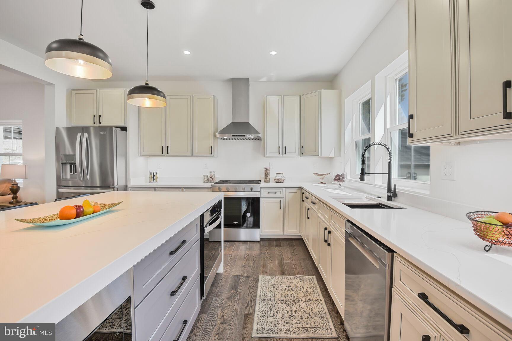 1612 Noyes Drive Silver Spring, MD 20910 - Photo 6 of 37 a kitchen with a sink stove and cabinets