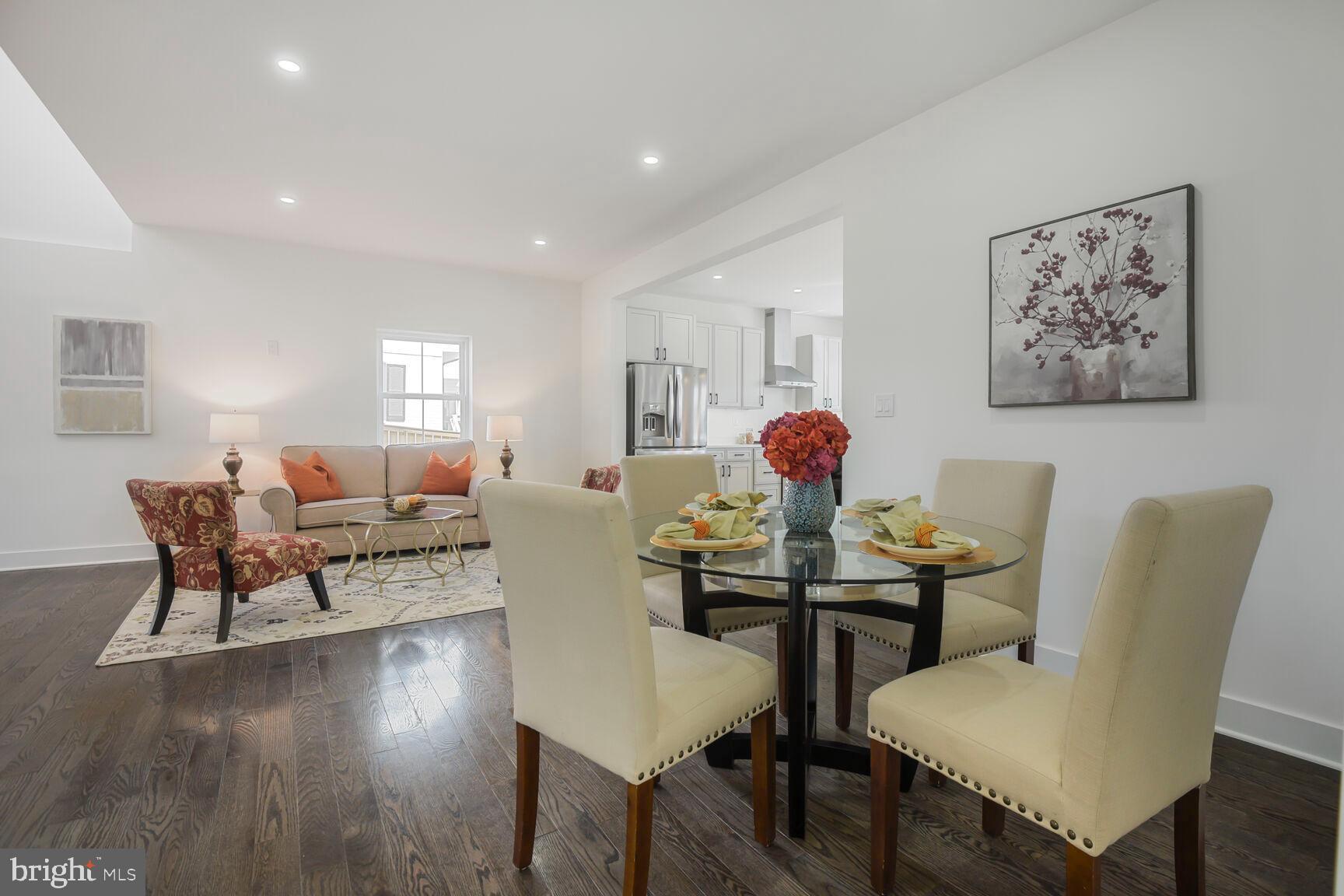 1612 Noyes Drive Silver Spring, MD 20910 - Photo 8 of 37 a view of a dining room with furniture and wooden floor