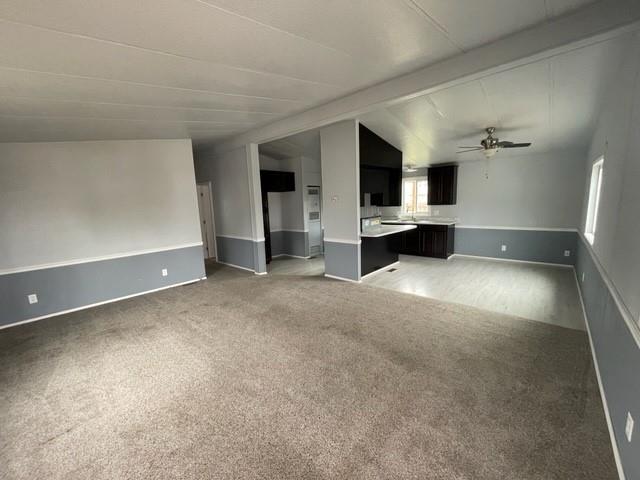 250 Davis Street Turlock, CA 95380 - Photo 3 of 11 a view of an empty room with window and a kitchen