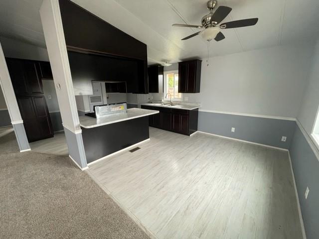 250 Davis Street Turlock, CA 95380 - Photo 4 of 11 a view of kitchen with sink microwave and stove