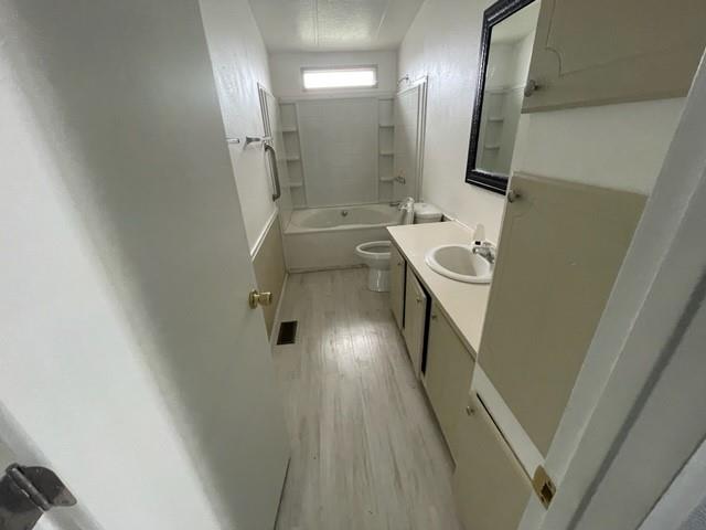 250 Davis Street Turlock, CA 95380 - Photo 6 of 11 a bathroom with a sink a toilet and shower
