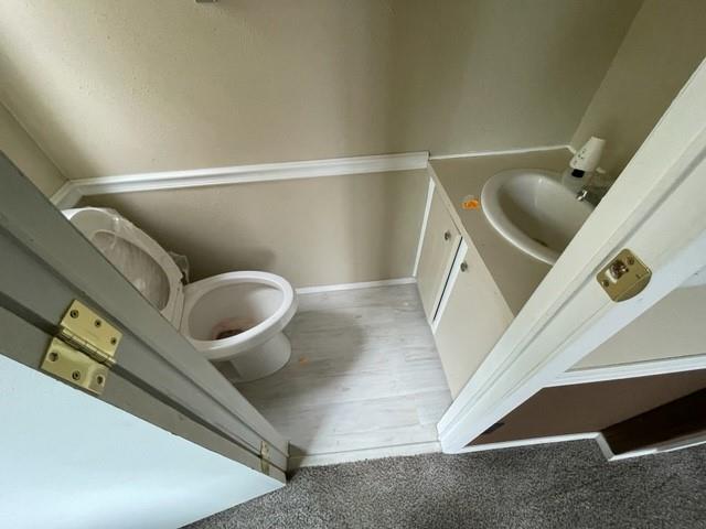 250 Davis Street Turlock, CA 95380 - Photo 9 of 11 a bathroom with a toilet and a mirror
