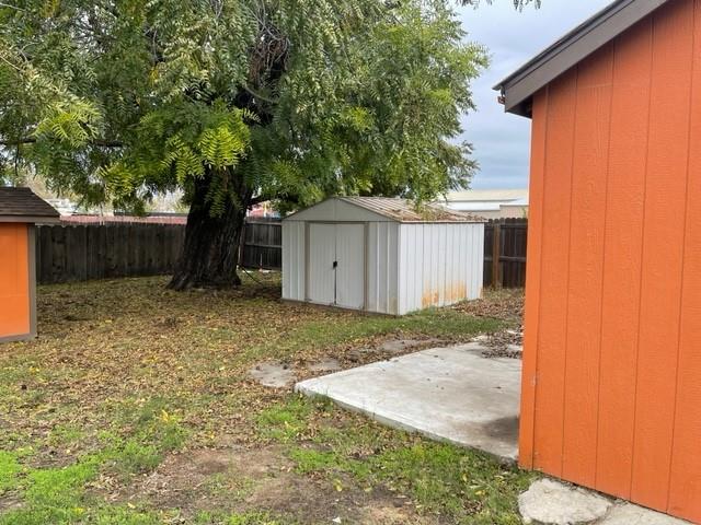 250 Davis Street Turlock, CA 95380 - Photo 10 of 11 a front view of a house with a yard and garage