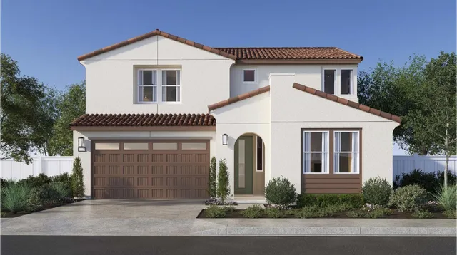 a front view of a house with garage