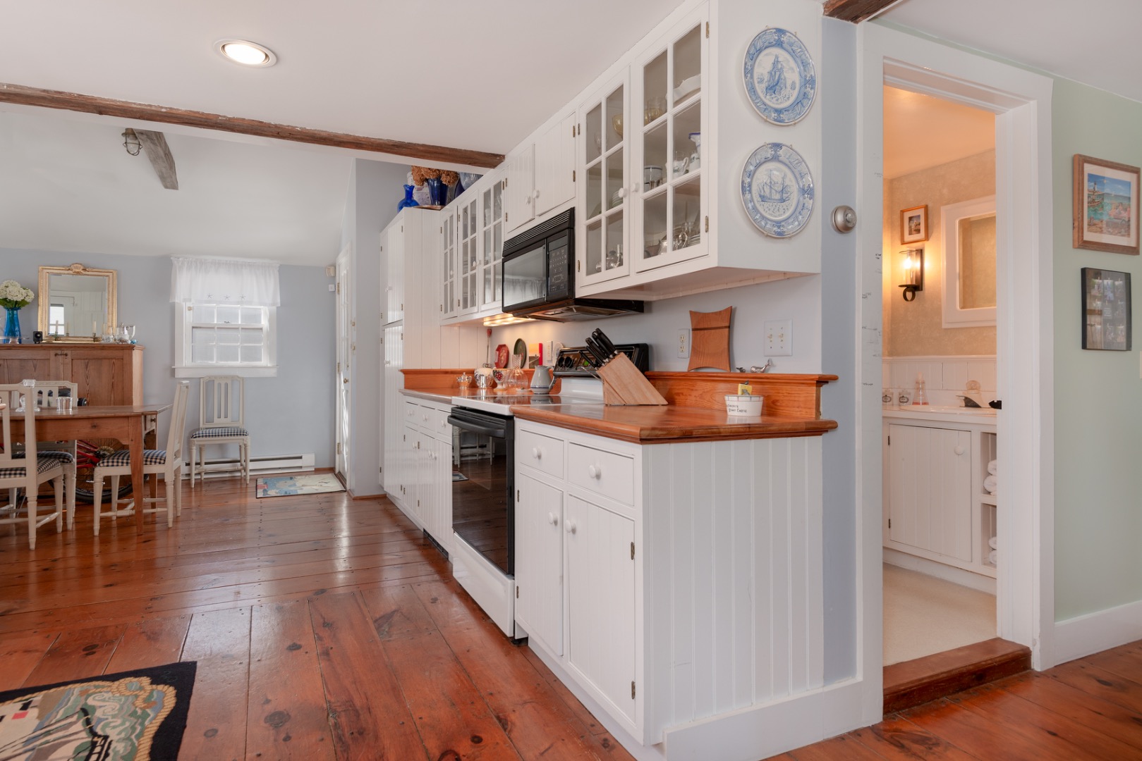 42 North Liberty Street Nantucket, MA 02554 - Photo 9 of 20 a kitchen with stainless steel appliances granite countertop a refrigerator and wooden floor