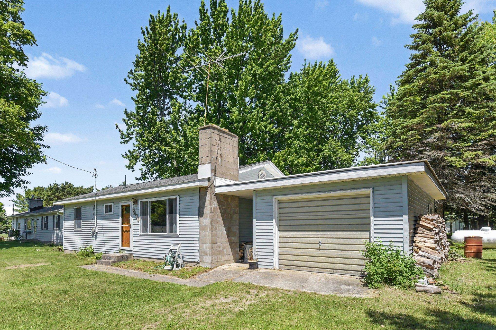 8439 Ridge Road Rapid City, MI 49676 - Photo 3 of 26 1947179-a5f56944-5d0a-44ab-bfe8-5a109a1a0ef7.JPG