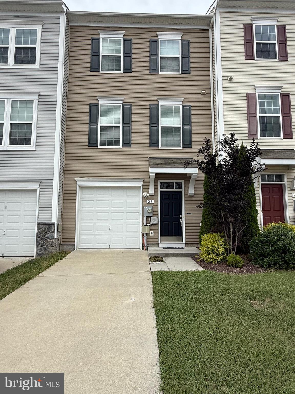 23 Landis Court Falling Waters, WV 25419 - Photo 1 of 45 a front view of a house with a yard and garage