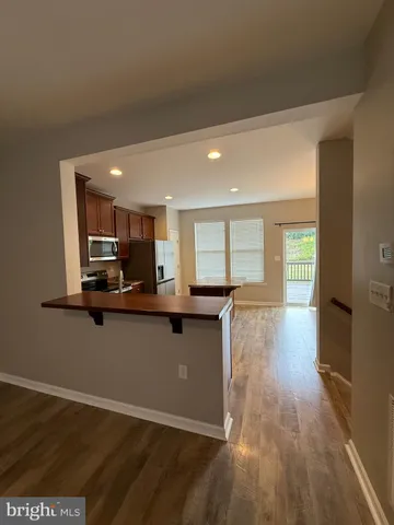 a kitchen with stainless steel appliances granite countertop a sink and cabinets