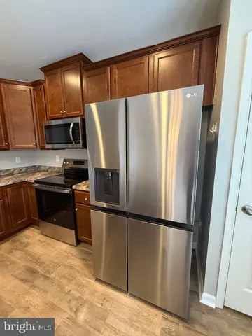 a room with pool table and window