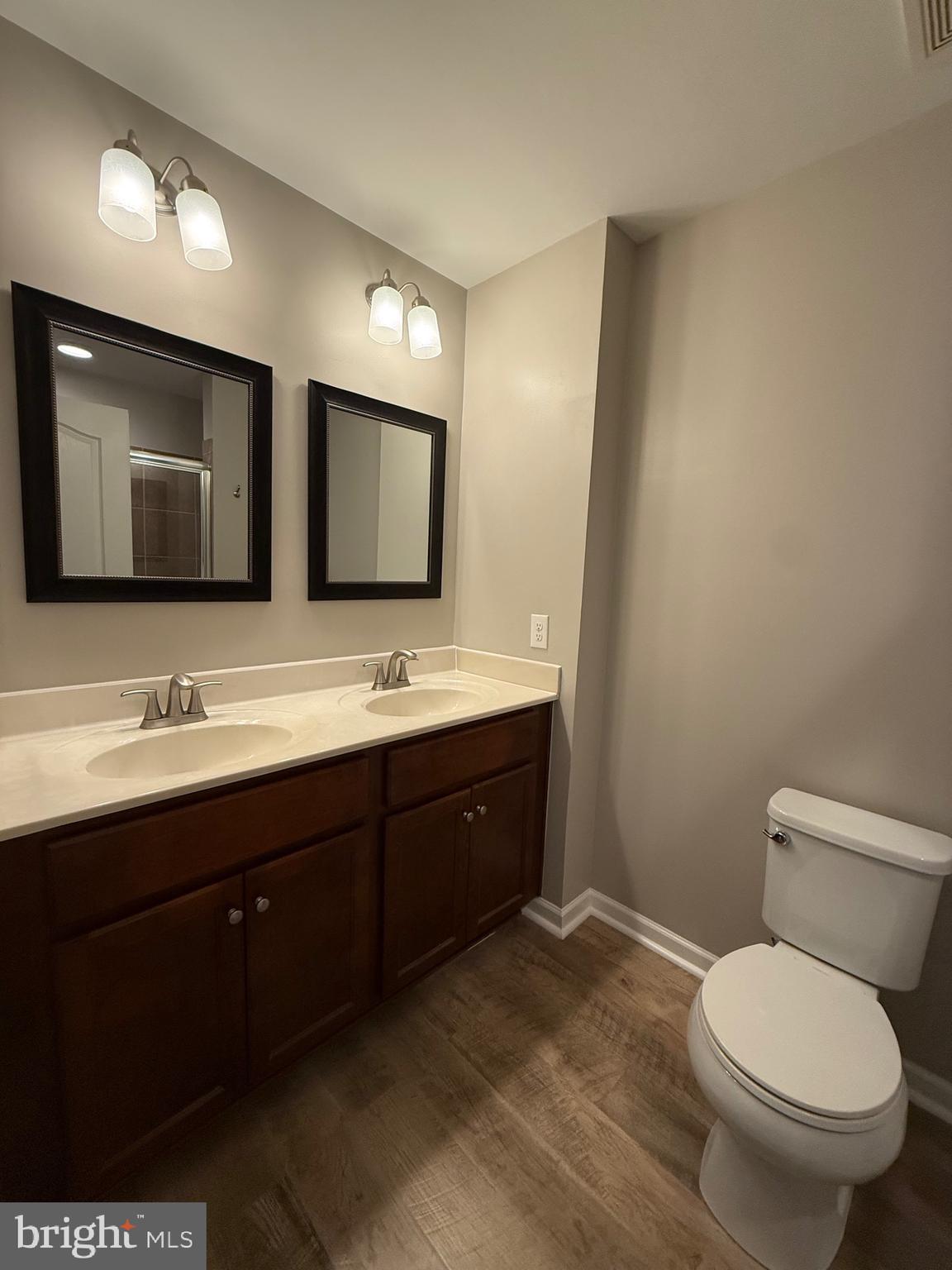 23 Landis Court Falling Waters, WV 25419 - Photo 25 of 45 a bathroom with a double vanity sink mirror and toilet
