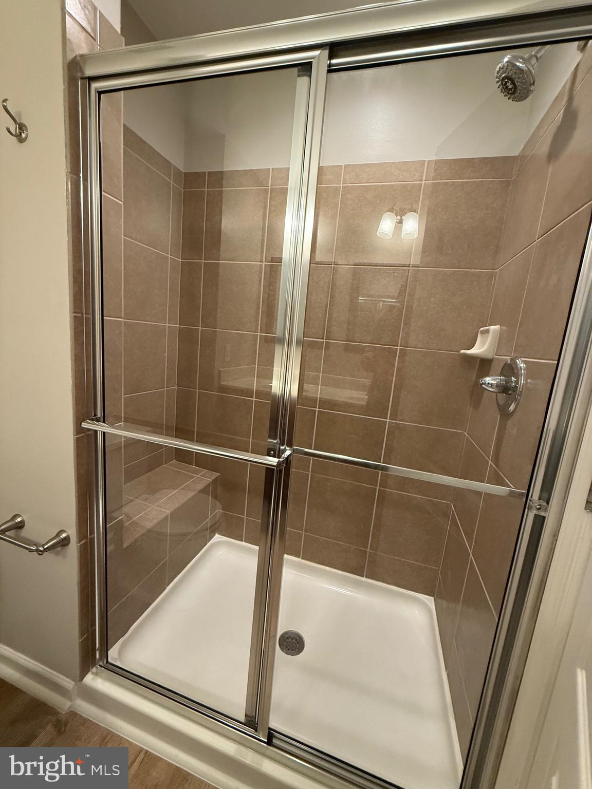 23 Landis Court Falling Waters, WV 25419 - Photo 27 of 45 a bathroom with a glass shower door