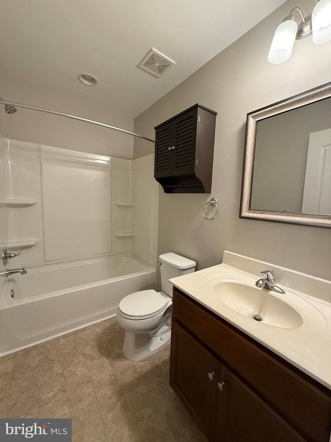 23 Landis Court Falling Waters, WV 25419 - Photo 29 of 45 a bathroom with a sink a toilet a mirror and bathtub