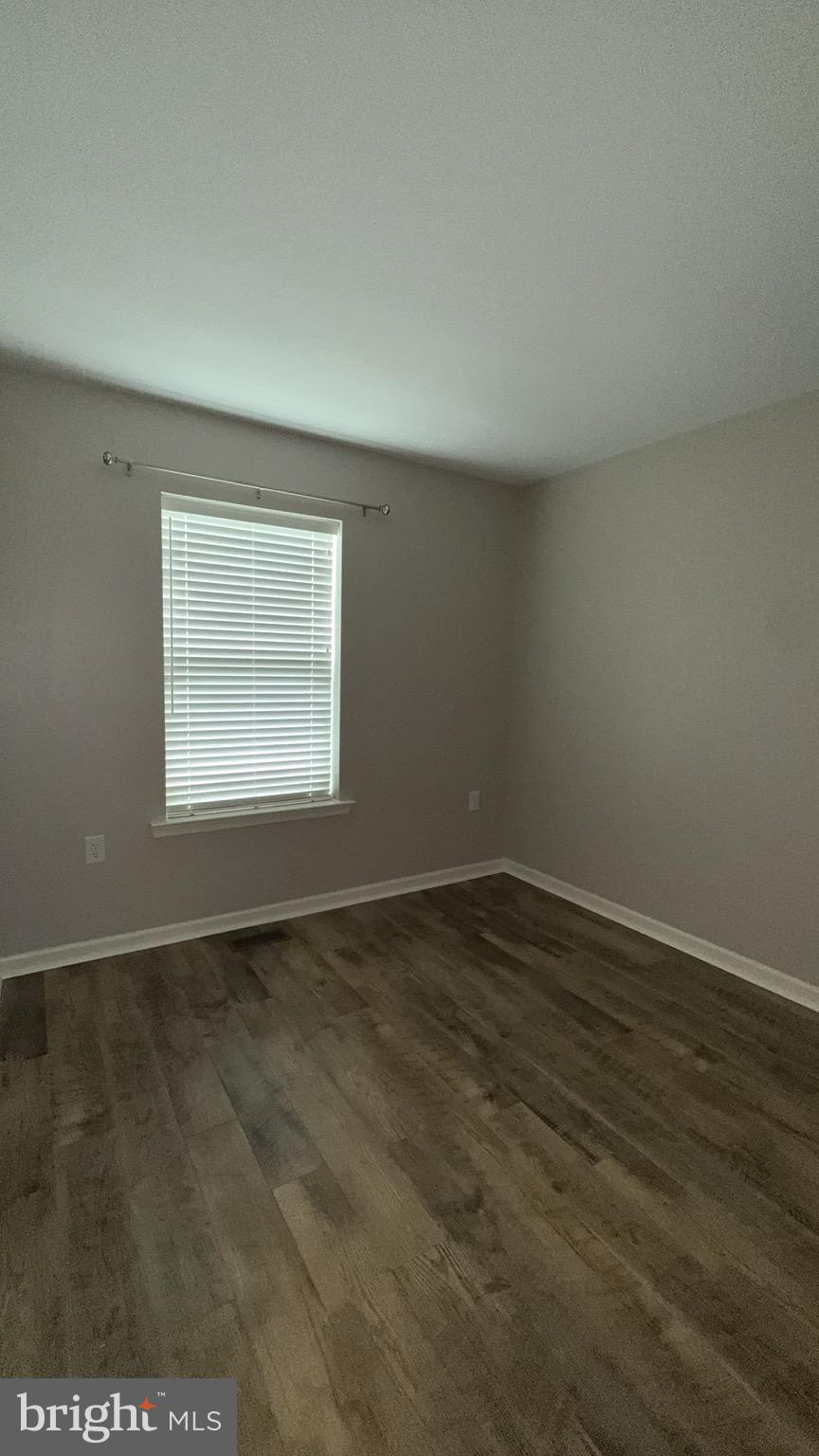 23 Landis Court Falling Waters, WV 25419 - Photo 31 of 45 an empty room with wooden floor and windows