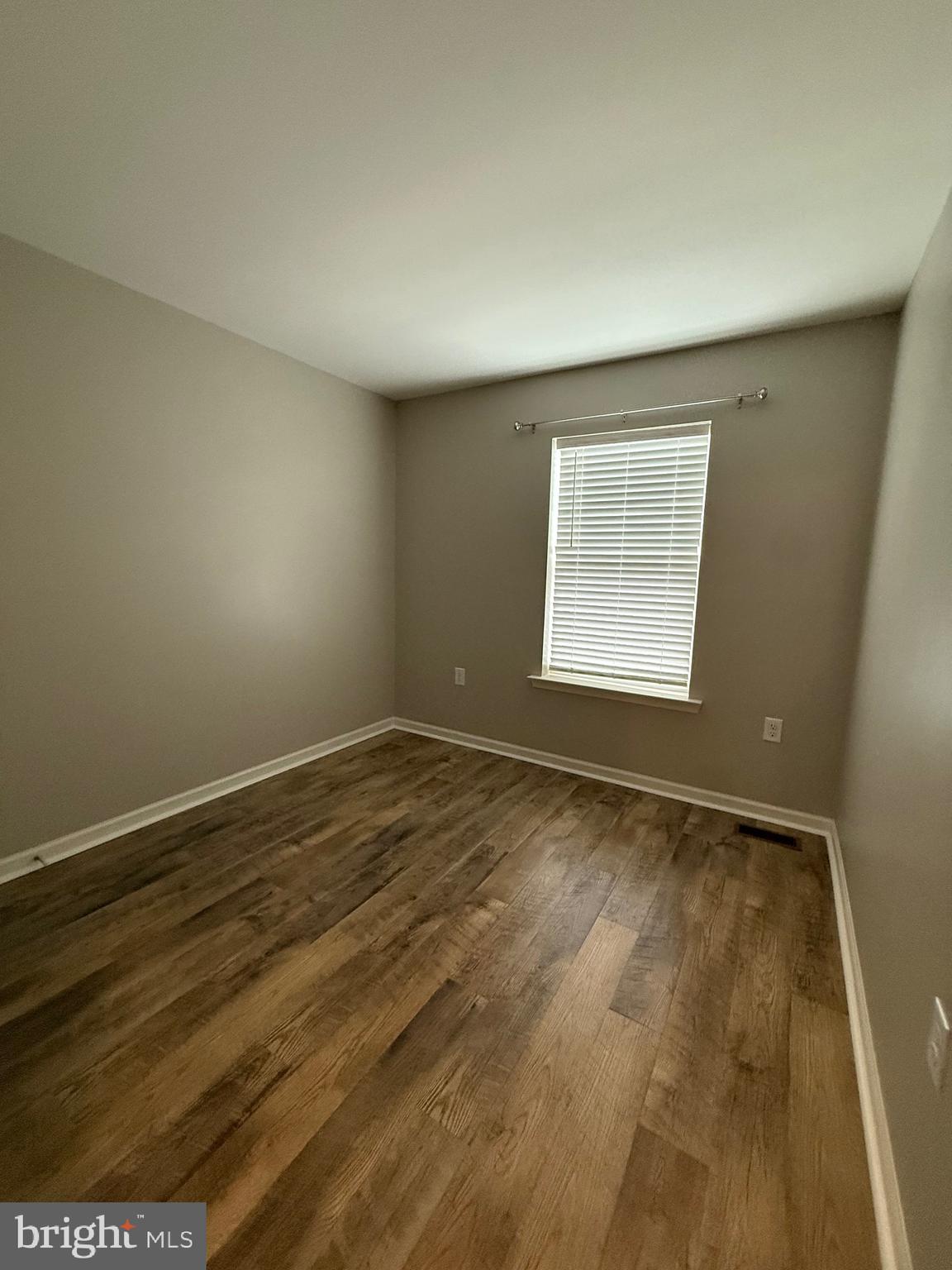 23 Landis Court Falling Waters, WV 25419 - Photo 34 of 45 wooden floor in an empty room with a window