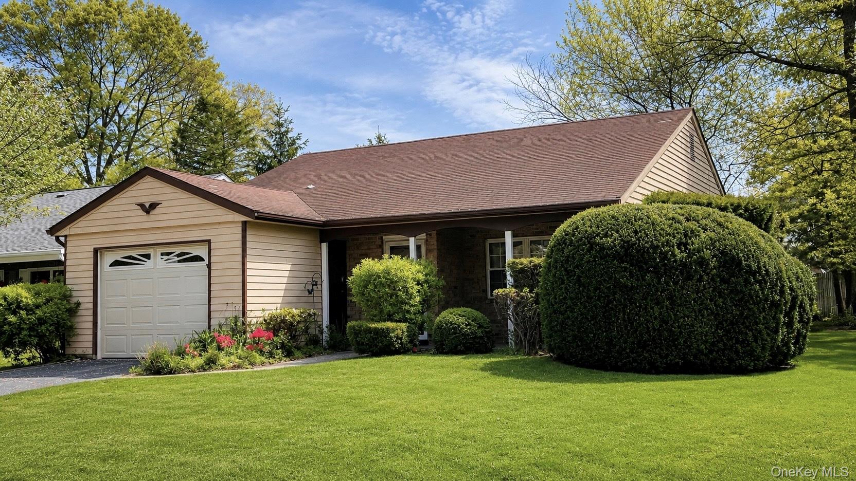 257 Edinburgh Drive Ridge, NY 11961 - Photo 2 of 10 a view of a house with backyard and garden