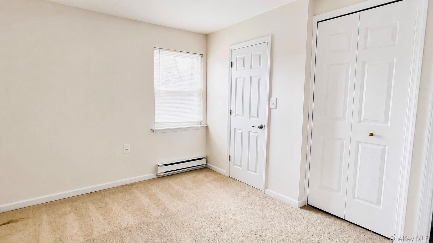 257 Edinburgh Drive Ridge, NY 11961 - Photo 8 of 10 a view of an empty room