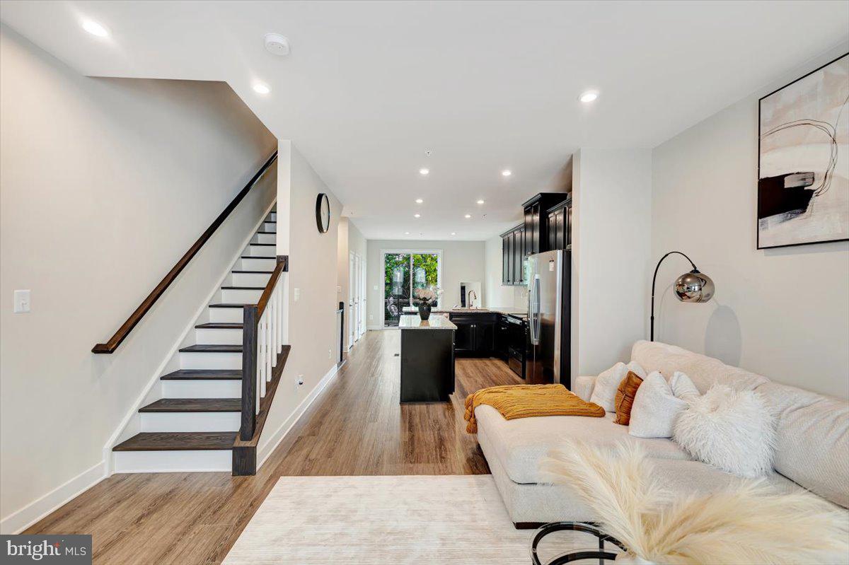 7157 Smoke Stack Road Baltimore, MD 21222 - Photo 15 of 27 a living room with furniture and wooden floor
