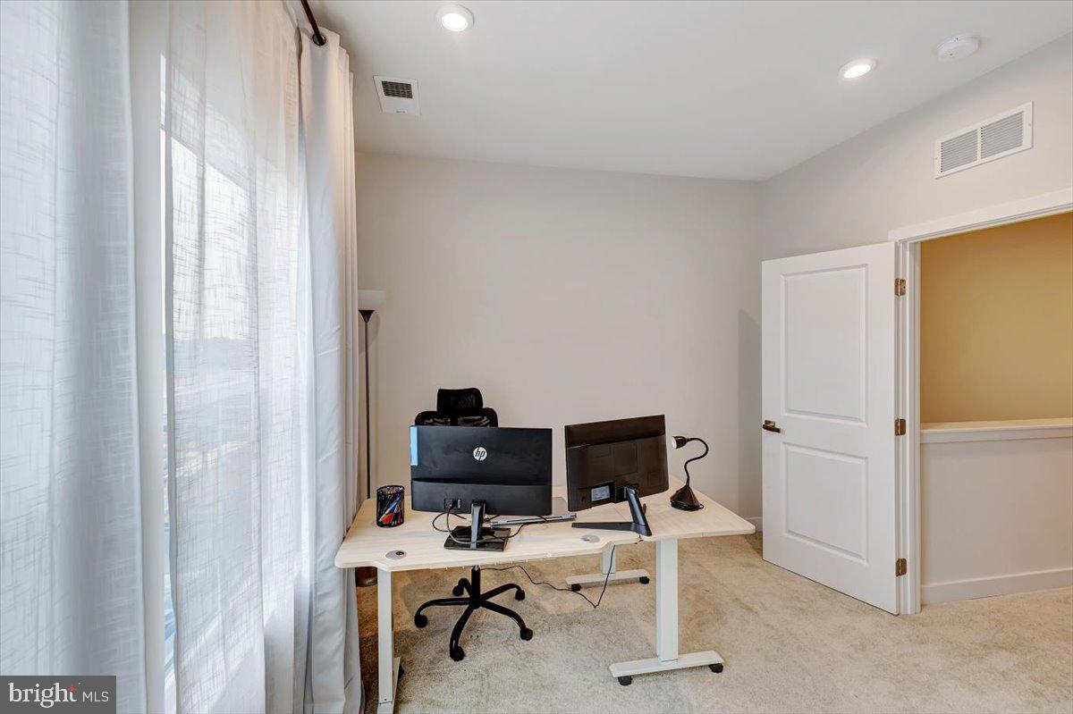 7157 Smoke Stack Road Baltimore, MD 21222 - Photo 20 of 27 a view of a workspace with furniture and a window