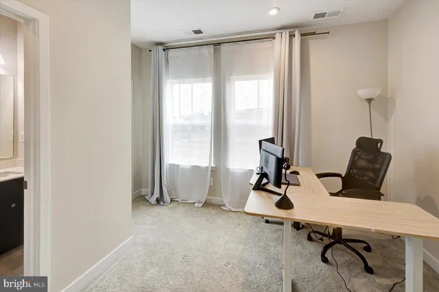 a room with gym equipment and a window