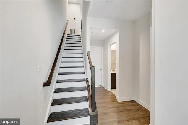 a view of an entryway with wooden floor