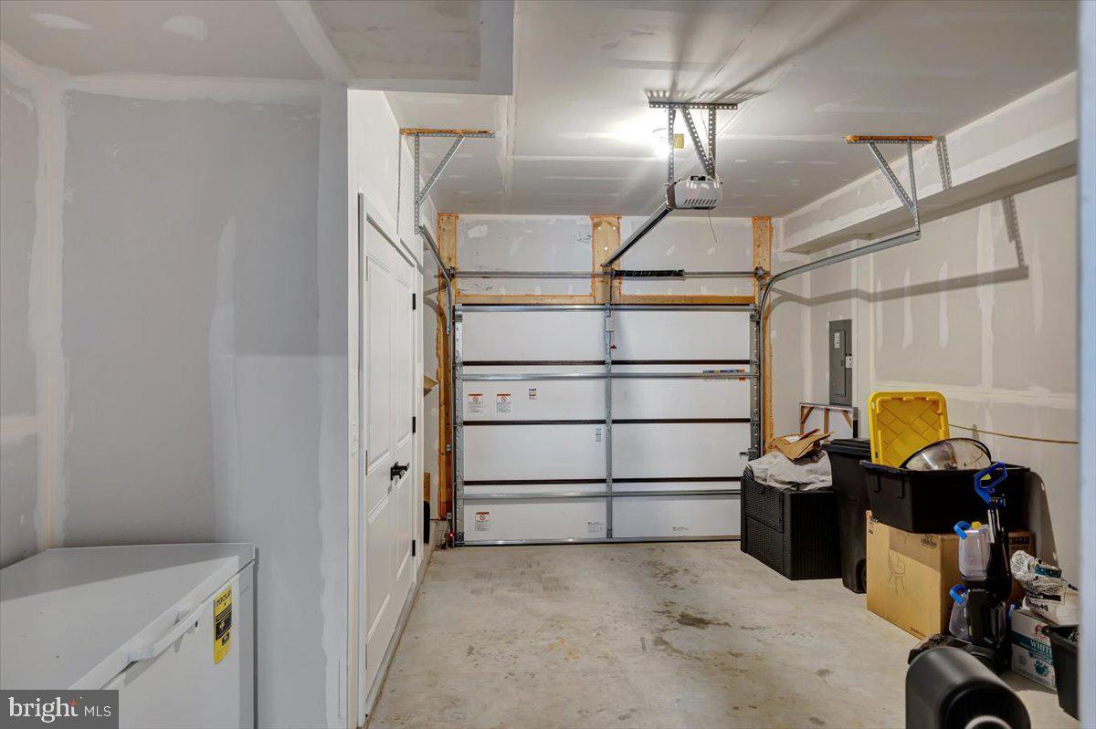 7157 Smoke Stack Road Baltimore, MD 21222 - Photo 7 of 27 a view of a storage & utility room with racks on the wall