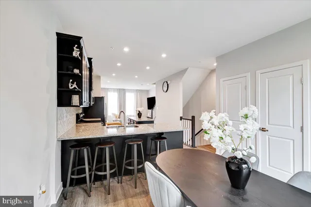 a view of kitchen with furniture and wooden floor
