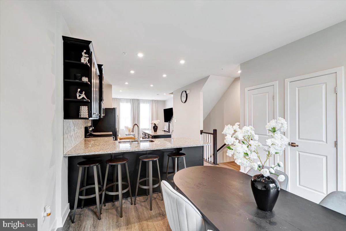 7157 Smoke Stack Road Baltimore, MD 21222 - Photo 8 of 27 a view of kitchen with furniture and wooden floor